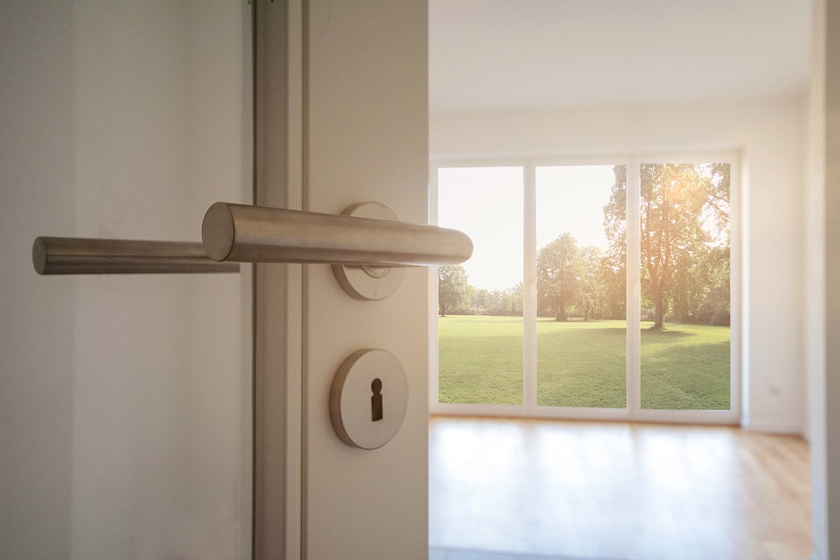 Relocation, Moving to new apartment - Door to modern living room with view to garden